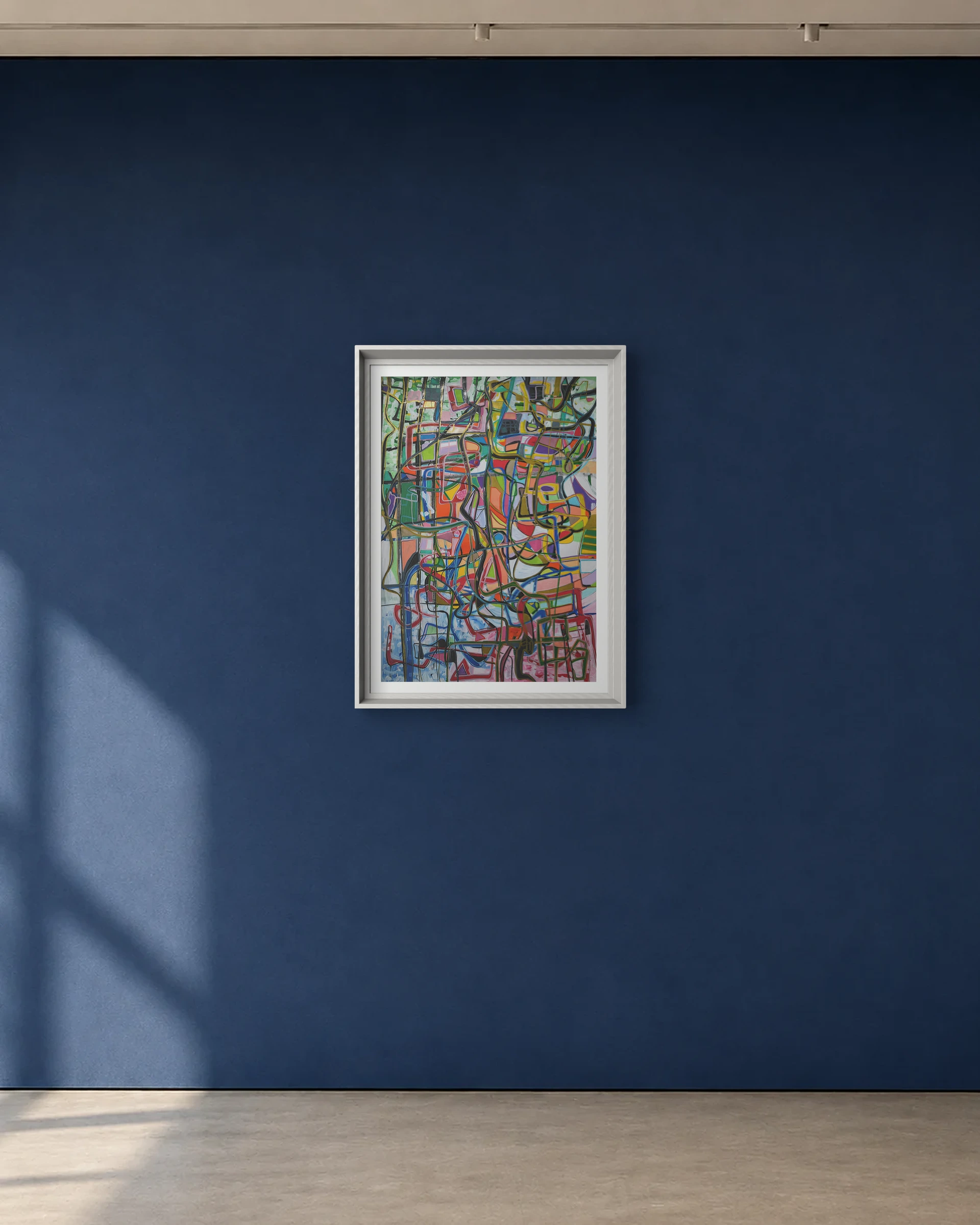 Color Grid Current shown framed on a deep blue gallery wall