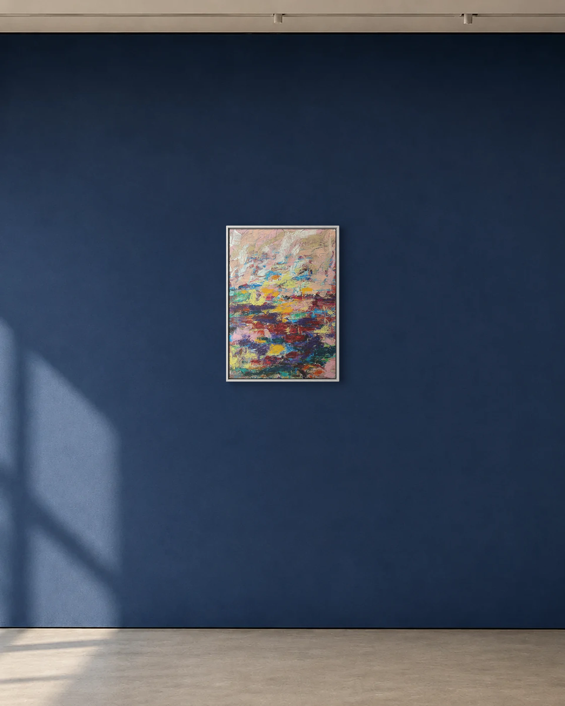 Field Notes shown framed on a deep blue gallery wall
