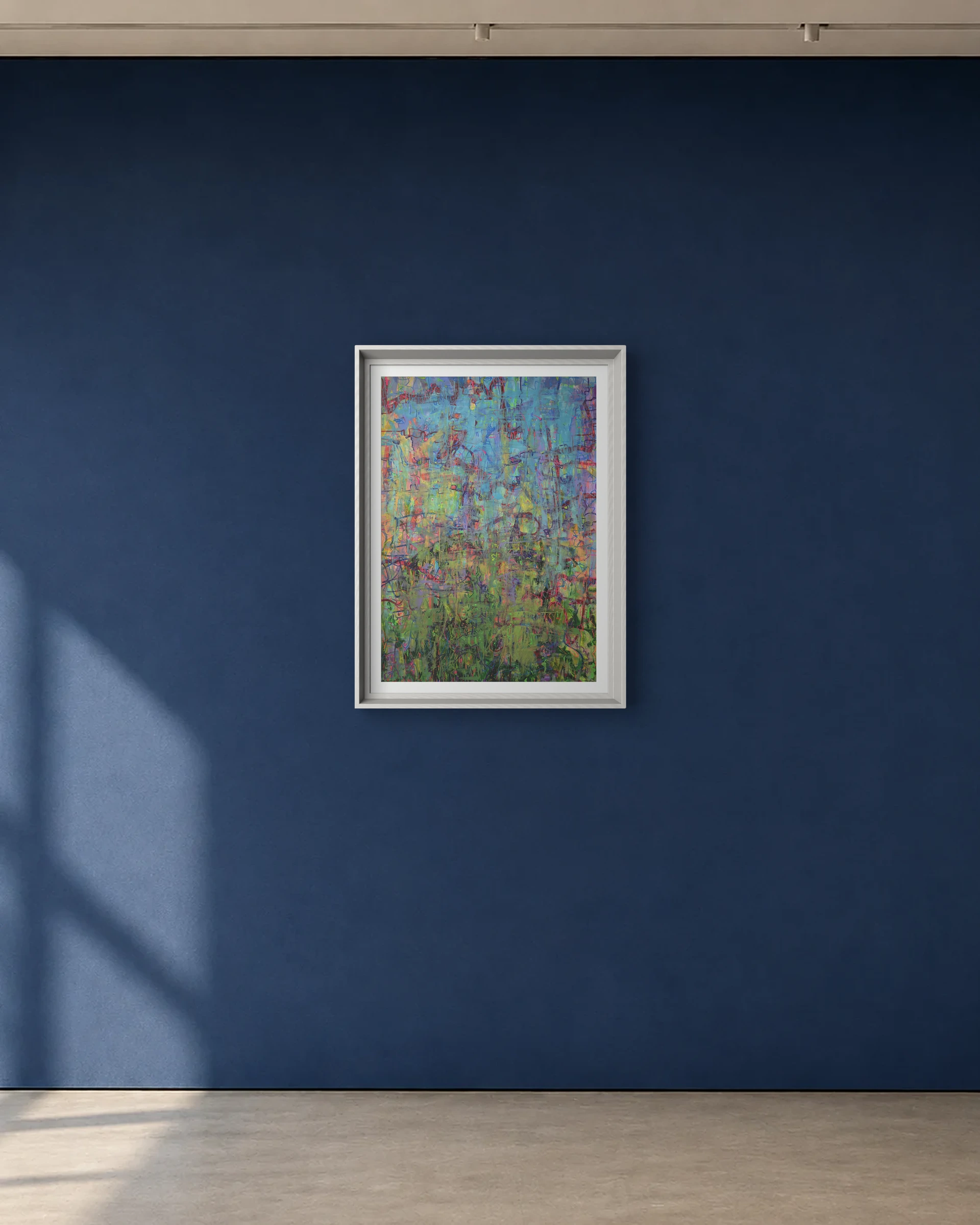 Iridescent Field shown framed on a deep blue gallery wall
