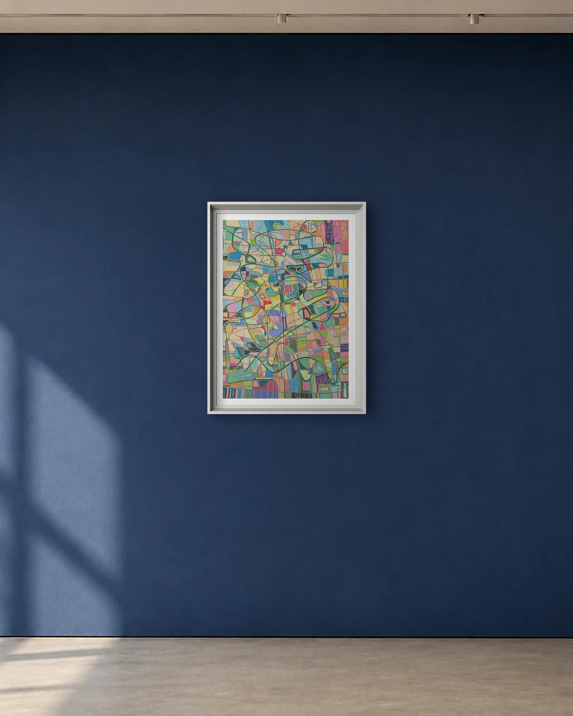 Soft City shown framed on a deep blue gallery wall