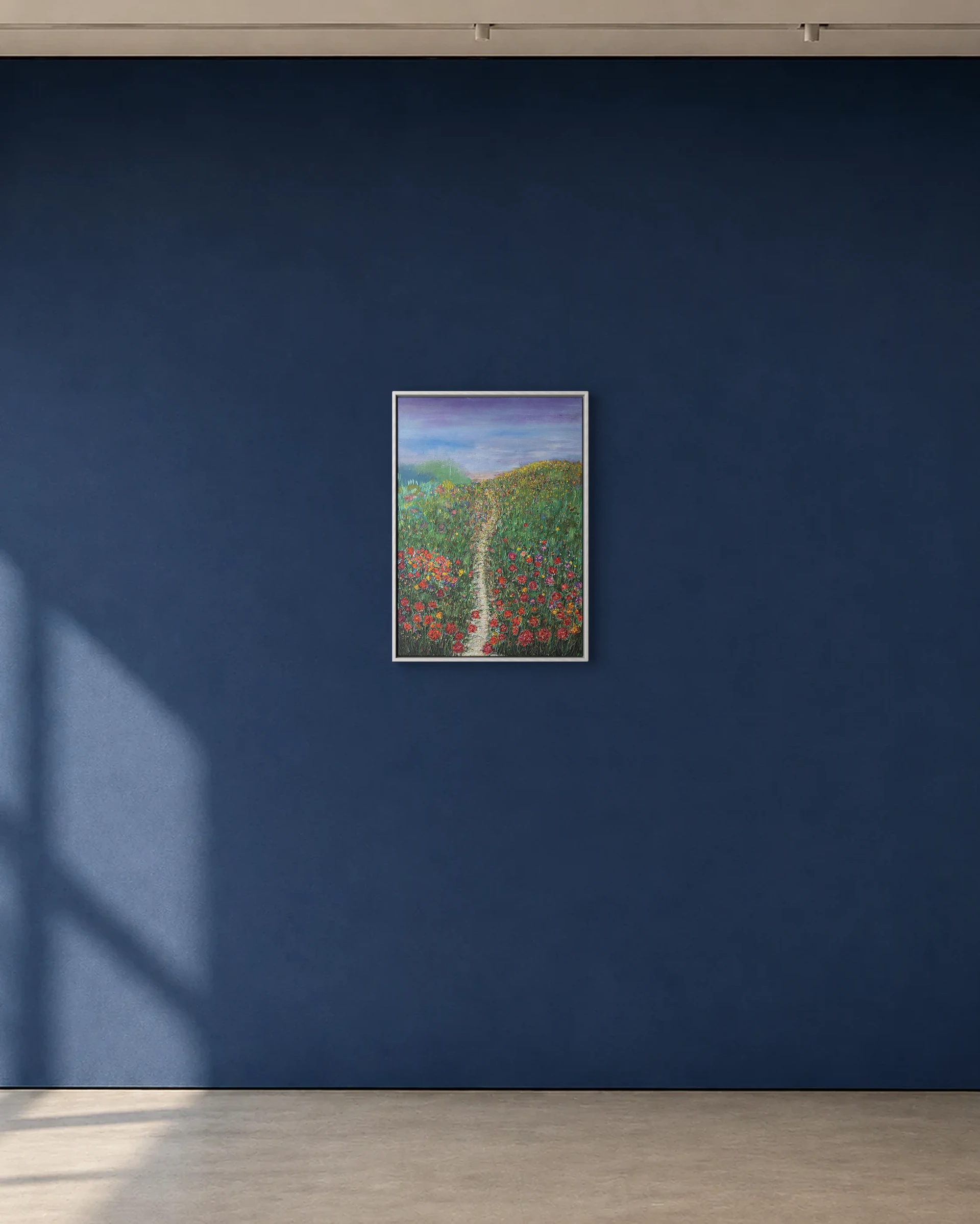 The Field Opens shown framed on a deep blue gallery wall