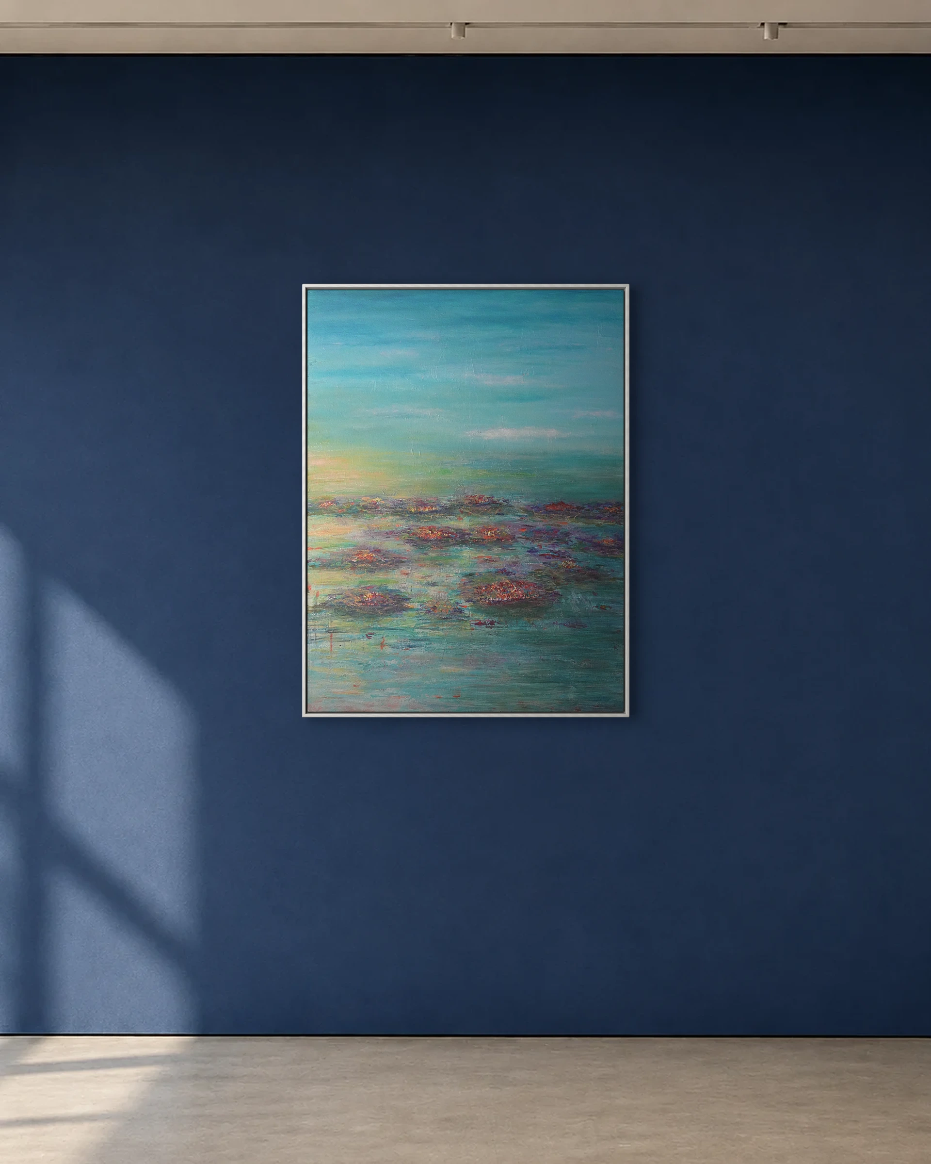 Water Garden shown framed on a deep blue gallery wall