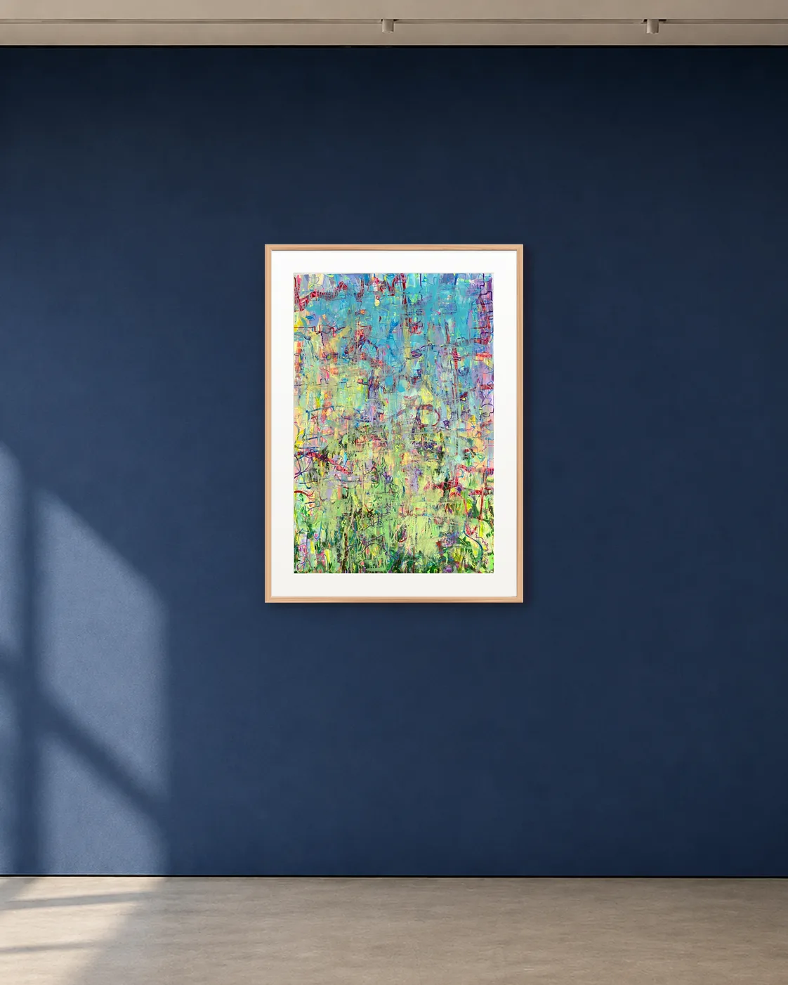 Iridescent Field shown framed on a deep blue gallery wall