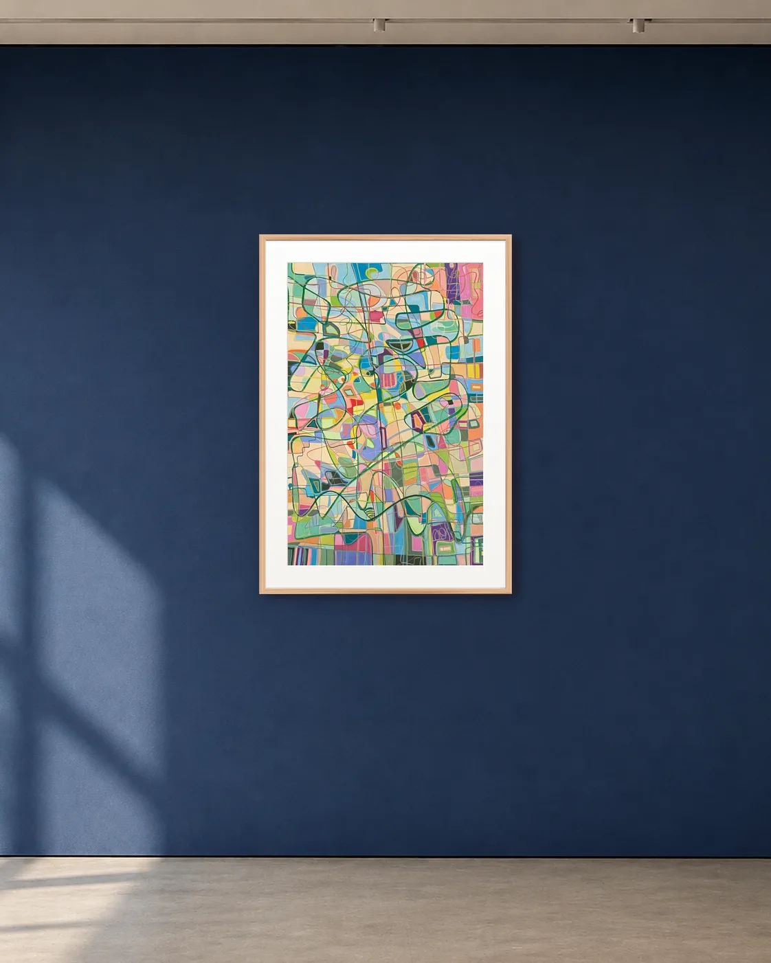 Soft City shown framed on a deep blue gallery wall