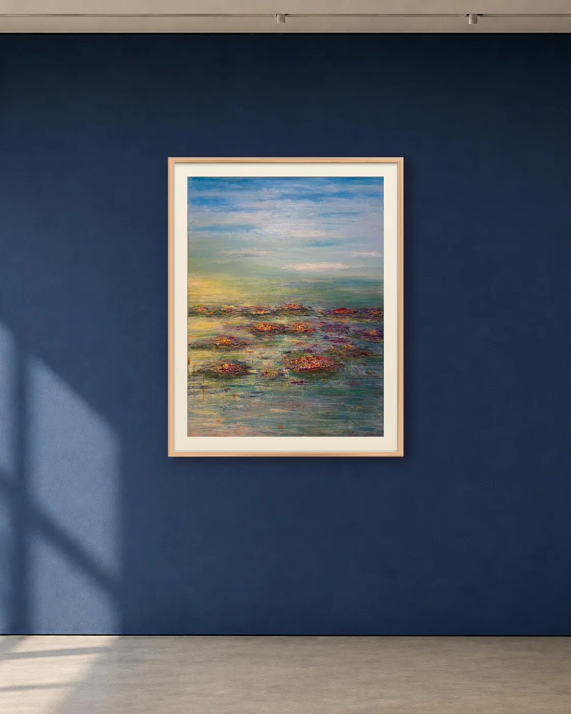 Water Garden shown framed on a deep blue gallery wall
